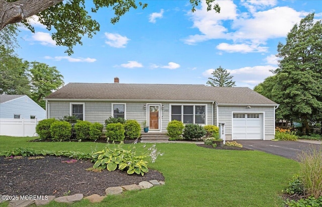 3100 Harrison St, Wall, NJ 07719 - single story home with an attached garage, asphalt driveway, and a chimney