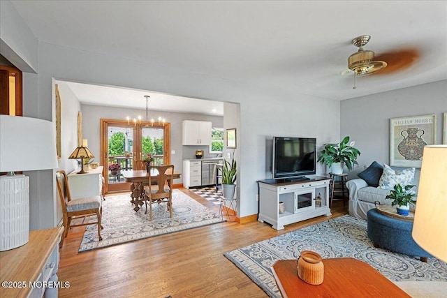 3100 Harrison St, Wall, NJ 07719 - living area with a chandelier, light wood-style floors, and a ceiling fan
