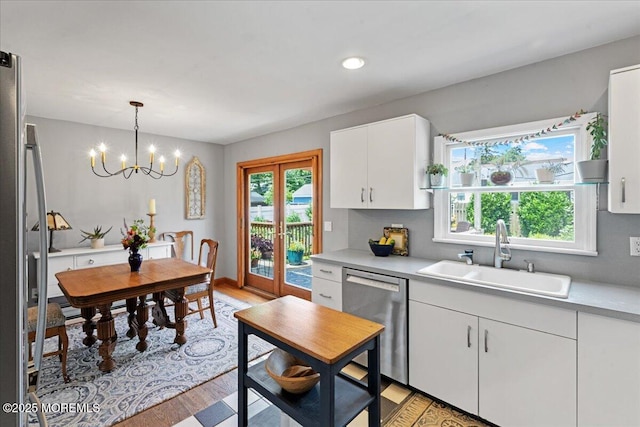 3100 Harrison St, Wall, NJ 07719 - kitchen featuring appliances with stainless steel finishes, light wood-style floors, light countertops, white cabinetry, and recessed lighting