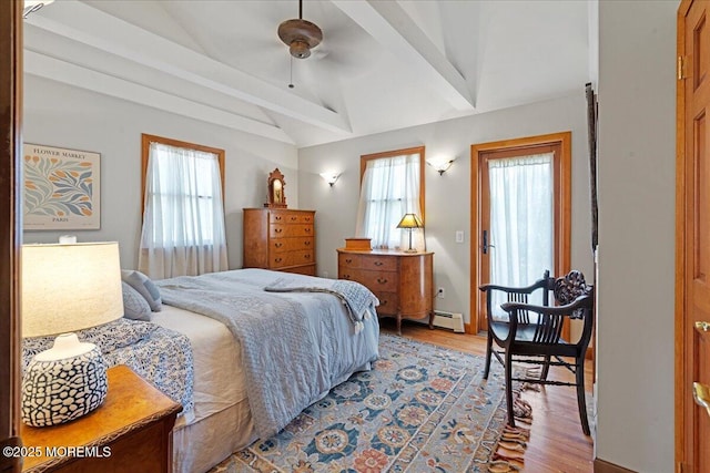 3100 Harrison St, Wall, NJ 07719 - bedroom with multiple windows, wood finished floors, a baseboard heating unit, and a ceiling fan