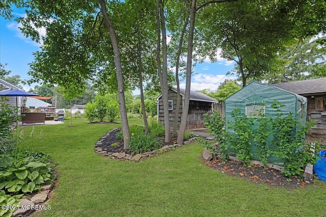 3100 Harrison St, Wall, NJ 07719 - view of grassy yard with a storage shed and a greenhouse