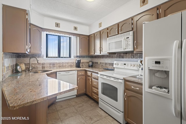 51 Hiering Ave Unit D9, Seaside Heights, NJ 08751 - kitchen with white appliances, backsplash, light tile patterned floors, and light stone counters