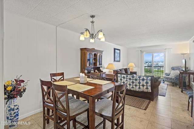 51 Hiering Ave Unit D9, Seaside Heights, NJ 08751 - dining area with a chandelier and light tile patterned floors