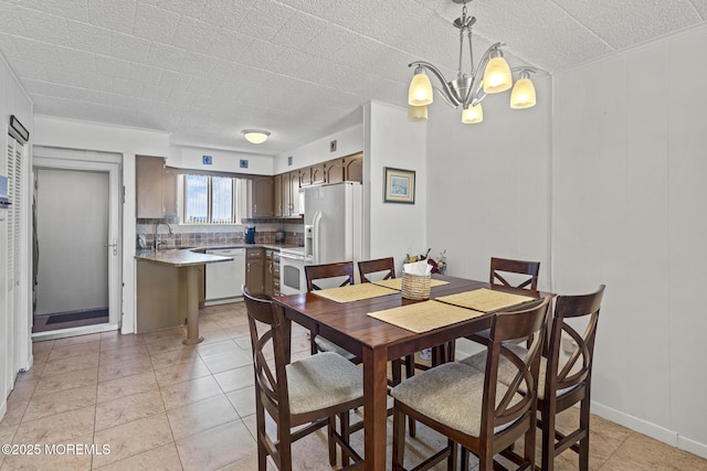 51 Hiering Ave Unit D9, Seaside Heights, NJ 08751 - dining room featuring a chandelier and light tile patterned floors