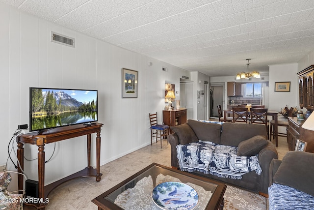 51 Hiering Ave Unit D9, Seaside Heights, NJ 08751 - living room with a chandelier and baseboards