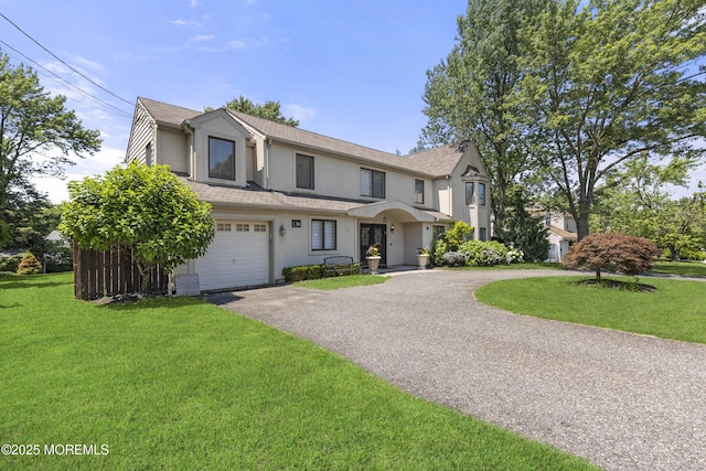 136 Sunset Rd, Lakewood, NJ 08701 - multi unit property with stucco siding, driveway, a garage, and a front yard