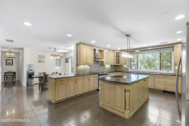 136 Sunset Rd, Lakewood, NJ 08701 - kitchen with wall chimney range hood, appliances with stainless steel finishes, a kitchen island, decorative backsplash, and recessed lighting