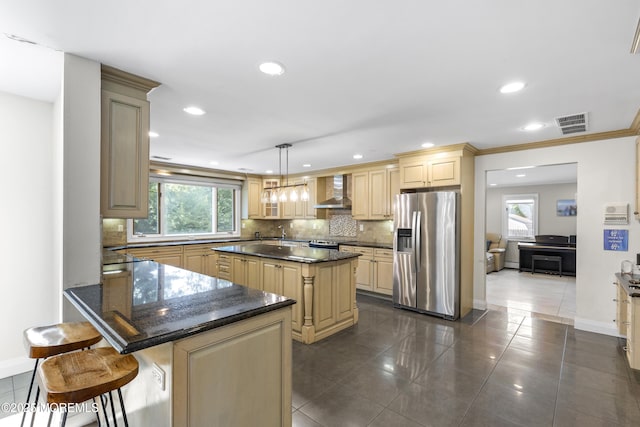 136 Sunset Rd, Lakewood, NJ 08701 - kitchen featuring stainless steel refrigerator with ice dispenser, wall chimney range hood, backsplash, healthy amount of natural light, and recessed lighting