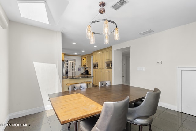 136 Sunset Rd, Lakewood, NJ 08701 - dining space featuring tile patterned floors, a skylight, recessed lighting, and a chandelier