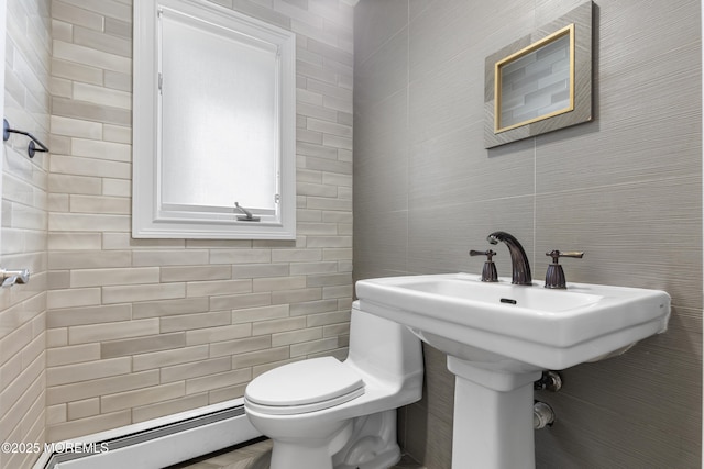 136 Sunset Rd, Lakewood, NJ 08701 - half bath with a baseboard heating unit and tile walls