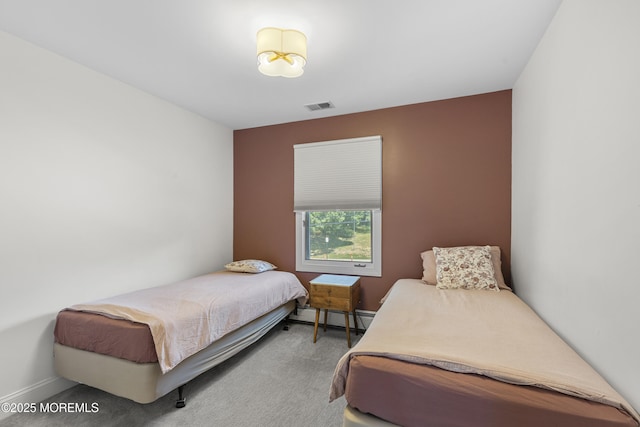 136 Sunset Rd, Lakewood, NJ 08701 - carpeted bedroom featuring a baseboard heating unit