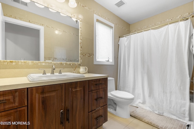 136 Sunset Rd, Lakewood, NJ 08701 - bathroom featuring vanity, tile patterned flooring, shower / bath combo, and tile walls