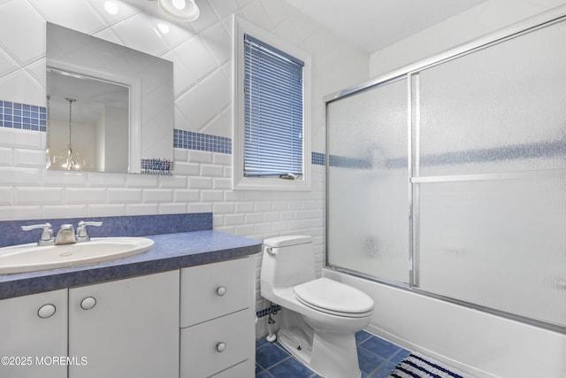 136 Sunset Rd, Lakewood, NJ 08701 - full bathroom featuring tile walls, vanity, bath / shower combo with glass door, and tile patterned floors