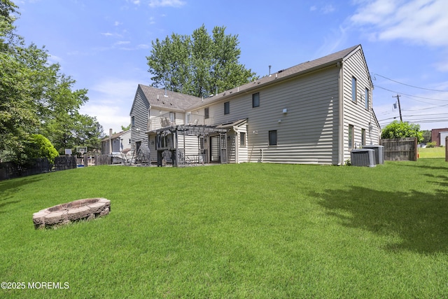 136 Sunset Rd, Lakewood, NJ 08701 - rear view of property with an outdoor fire pit and a pergola