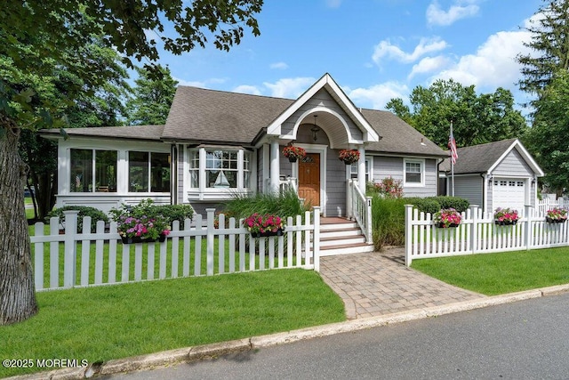 1 Cedar Ave, Rumson, NJ 07760 - view of front of home featuring a fenced front yard, a shingled roof, and a detached garage
