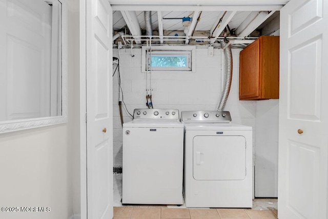 1 Cedar Ave, Rumson, NJ 07760 - laundry room with cabinet space, washing machine and clothes dryer, light tile patterned floors, and concrete block wall