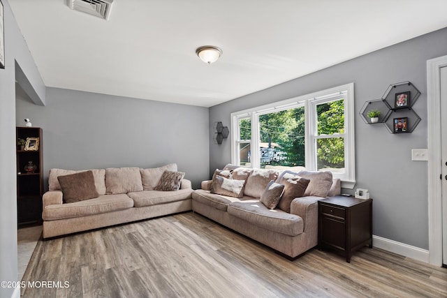 482 Radovan Ave, Bayville, NJ 08721 - living room featuring light wood-style flooring and baseboards