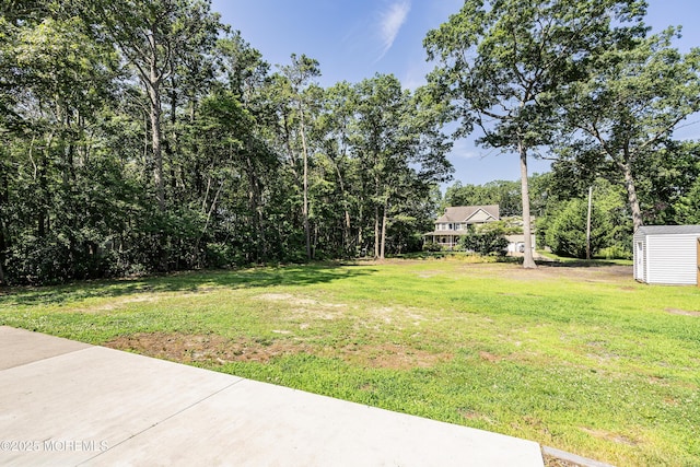 482 Radovan Ave, Bayville, NJ 08721 - view of green lawn featuring a shed
