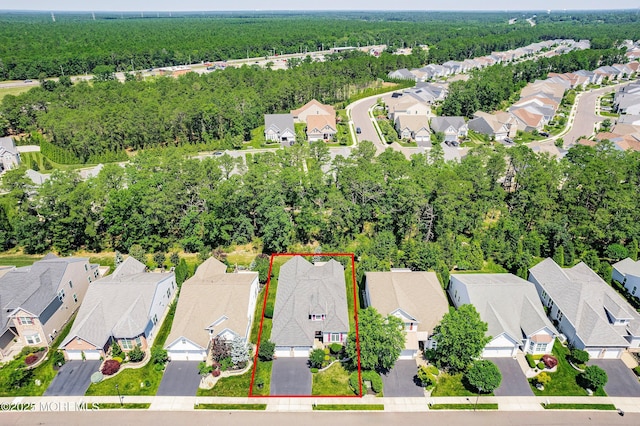 16 Gladstone St, Forked River, NJ 08731 - aerial perspective of suburban area with property boundaries highlighted and a heavily wooded area