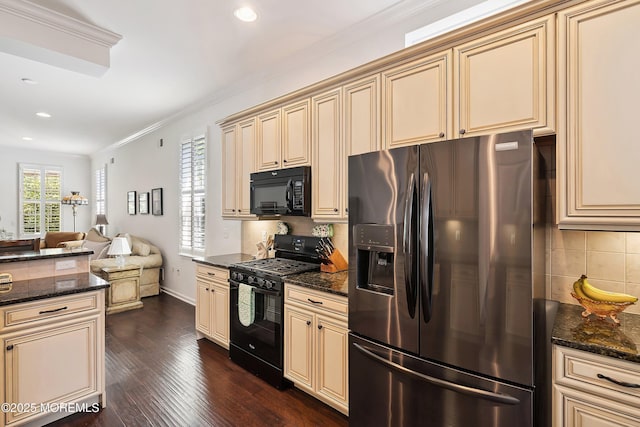 16 Gladstone St, Forked River, NJ 08731 - kitchen with black appliances, cream cabinets, backsplash, open floor plan, and ornamental molding