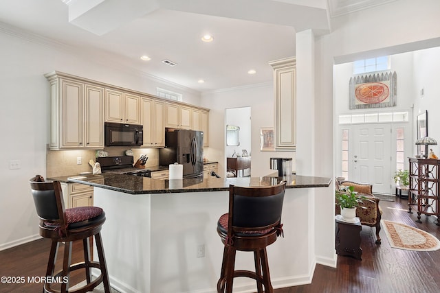 16 Gladstone St, Forked River, NJ 08731 - kitchen with black microwave, fridge with ice dispenser, cream cabinets, range with electric stovetop, and crown molding