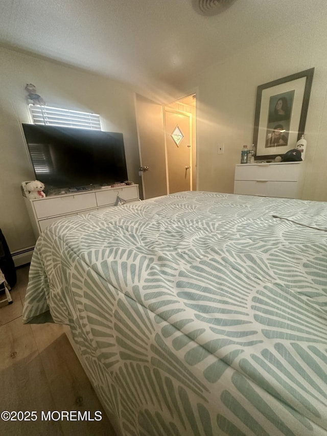 1006 Nocturn Way, Toms River, NJ 08755 - bedroom with wood finished floors and baseboard heating