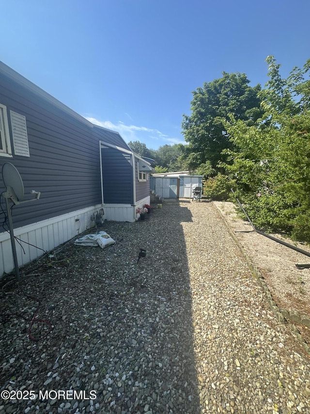 1006 Nocturn Way, Toms River, NJ 08755 - view of yard featuring a storage unit