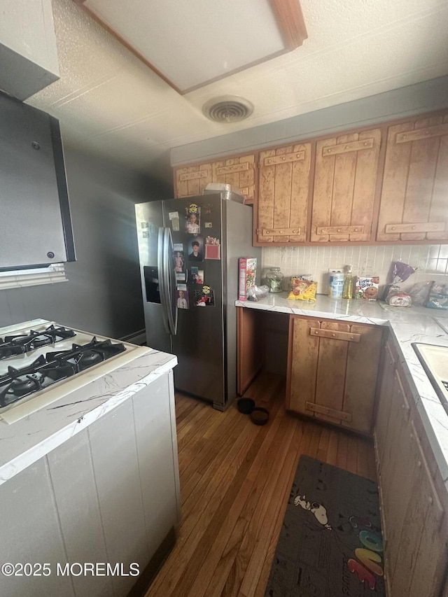 1006 Nocturn Way, Toms River, NJ 08755 - kitchen featuring stainless steel fridge with ice dispenser, dark wood-type flooring, light countertops, and white gas cooktop