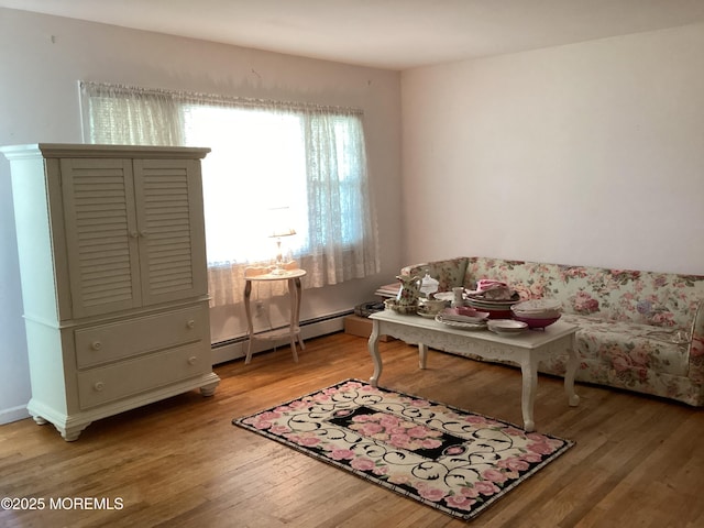 109 Edinburgh Ct, Toms River, NJ 08757 - sitting room with baseboard heating and light wood-style flooring