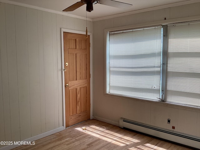 109 Edinburgh Ct, Toms River, NJ 08757 - spare room with a baseboard heating unit, crown molding, light wood-type flooring, and ceiling fan