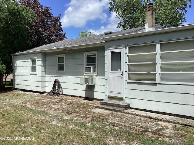 109 Edinburgh Ct, Toms River, NJ 08757 - rear view of property with a shingled roof, a chimney, and cooling unit