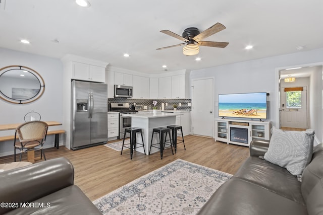 911 Beach Ave, Bradley Beach, NJ 07720 - living area featuring light wood-style flooring, a ceiling fan, and recessed lighting