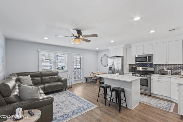 911 Beach Ave, Bradley Beach, NJ 07720 - living area featuring a ceiling fan, wood finished floors, and recessed lighting