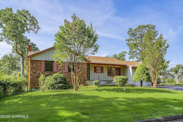 2238 Emerald Park Dr, Forked River, NJ 08731 - ranch-style home with board and batten siding, a front lawn, a chimney, and brick siding