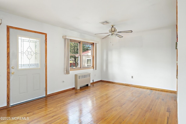 2238 Emerald Park Dr, Forked River, NJ 08731 - foyer with radiator, light wood-style flooring, and a ceiling fan