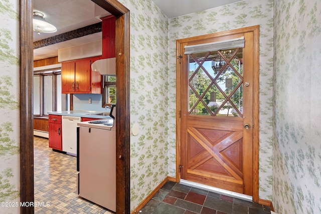 2238 Emerald Park Dr, Forked River, NJ 08731 - kitchen featuring wallpapered walls, a baseboard radiator, white dishwasher, healthy amount of natural light, and light countertops