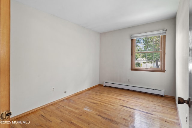 2238 Emerald Park Dr, Forked River, NJ 08731 - unfurnished room featuring a baseboard heating unit and light wood finished floors