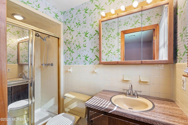 2238 Emerald Park Dr, Forked River, NJ 08731 - full bath with wallpapered walls, tile walls, a stall shower, vanity, and a wainscoted wall