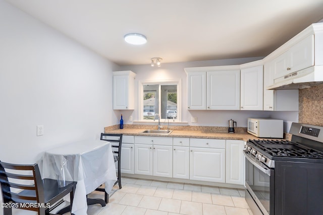 51 Berkshire Ct, Toms River, NJ 08753 - kitchen featuring stainless steel gas range oven, under cabinet range hood, white microwave, light countertops, and white cabinets