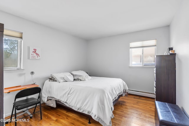 51 Berkshire Ct, Toms River, NJ 08753 - bedroom with a baseboard radiator and wood finished floors