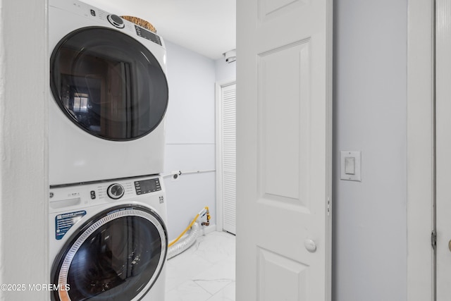51 Berkshire Ct, Toms River, NJ 08753 - laundry room featuring stacked washer and clothes dryer and marble finish flooring
