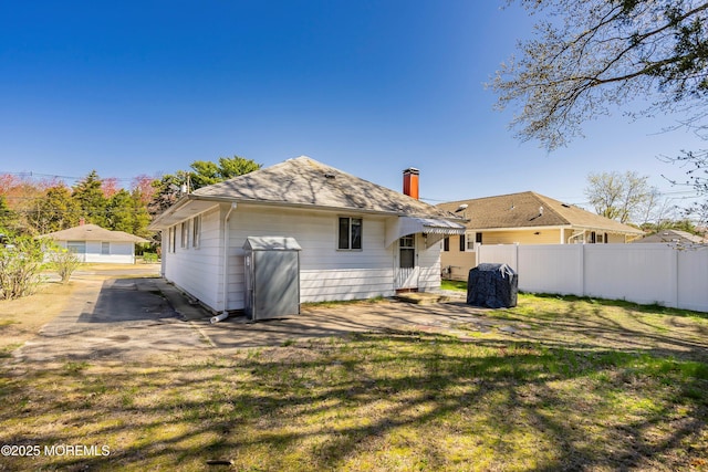 51 Berkshire Ct, Toms River, NJ 08753 - rear view of property featuring a chimney and a shingled roof