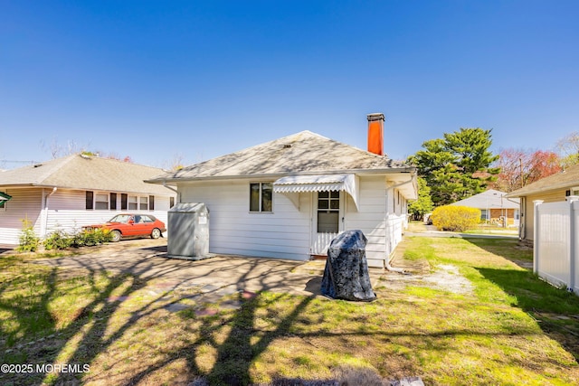 51 Berkshire Ct, Toms River, NJ 08753 - rear view of property featuring a chimney