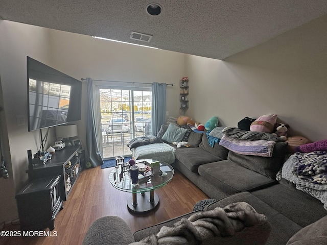 6 Madison Ct, Tinton Falls, NJ 07712 - living room featuring a textured ceiling and light wood-style floors