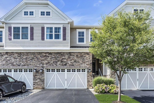 30 Malcolm Way, Lincroft, NJ 07738 - view of front of house with stone siding, a garage, and driveway