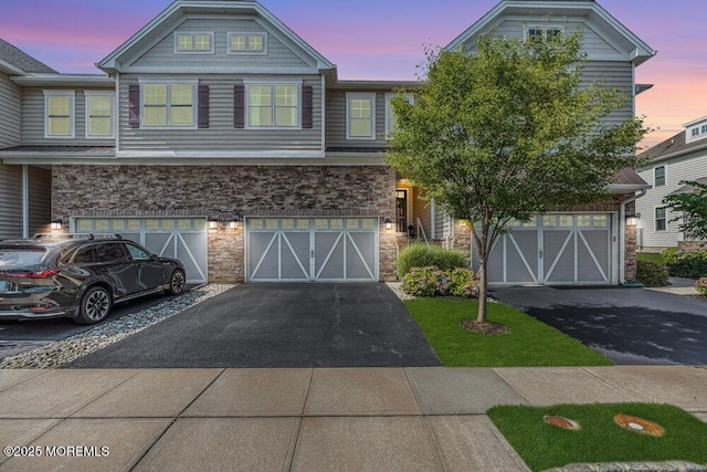30 Malcolm Way, Lincroft, NJ 07738 - townhome / multi-family property with stone siding, driveway, and an attached garage