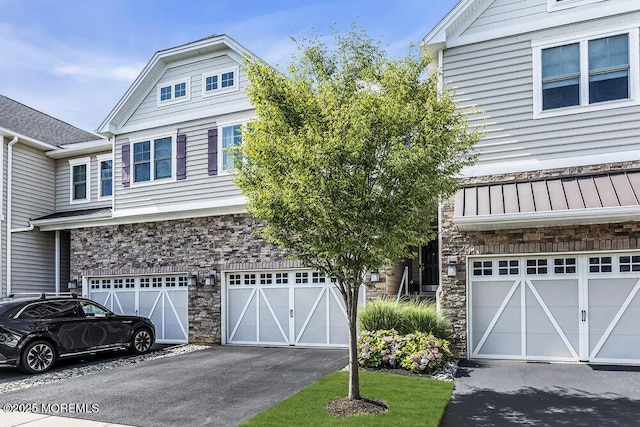 30 Malcolm Way, Lincroft, NJ 07738 - view of front of property with stone siding, an attached garage, and driveway