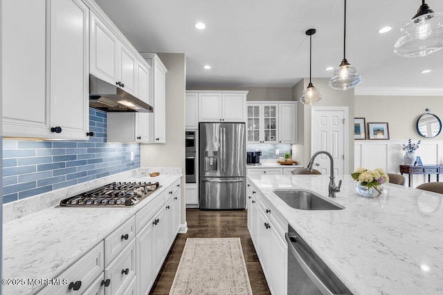 30 Malcolm Way, Lincroft, NJ 07738 - kitchen featuring appliances with stainless steel finishes, under cabinet range hood, white cabinetry, light stone countertops, and glass insert cabinets
