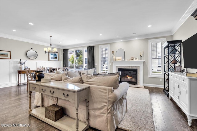 30 Malcolm Way, Lincroft, NJ 07738 - living room featuring a chandelier, dark wood-style flooring, a high end fireplace, recessed lighting, and ornamental molding