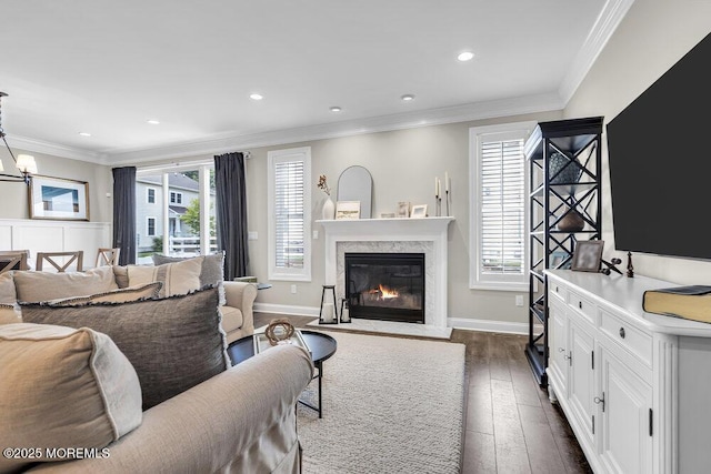 30 Malcolm Way, Lincroft, NJ 07738 - living area with a premium fireplace, dark wood finished floors, recessed lighting, crown molding, and a chandelier